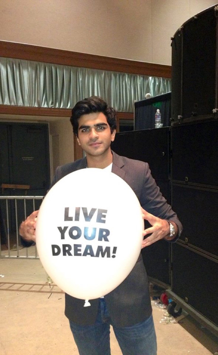 Holding a balloon printed with LIVE YOUR DREAM