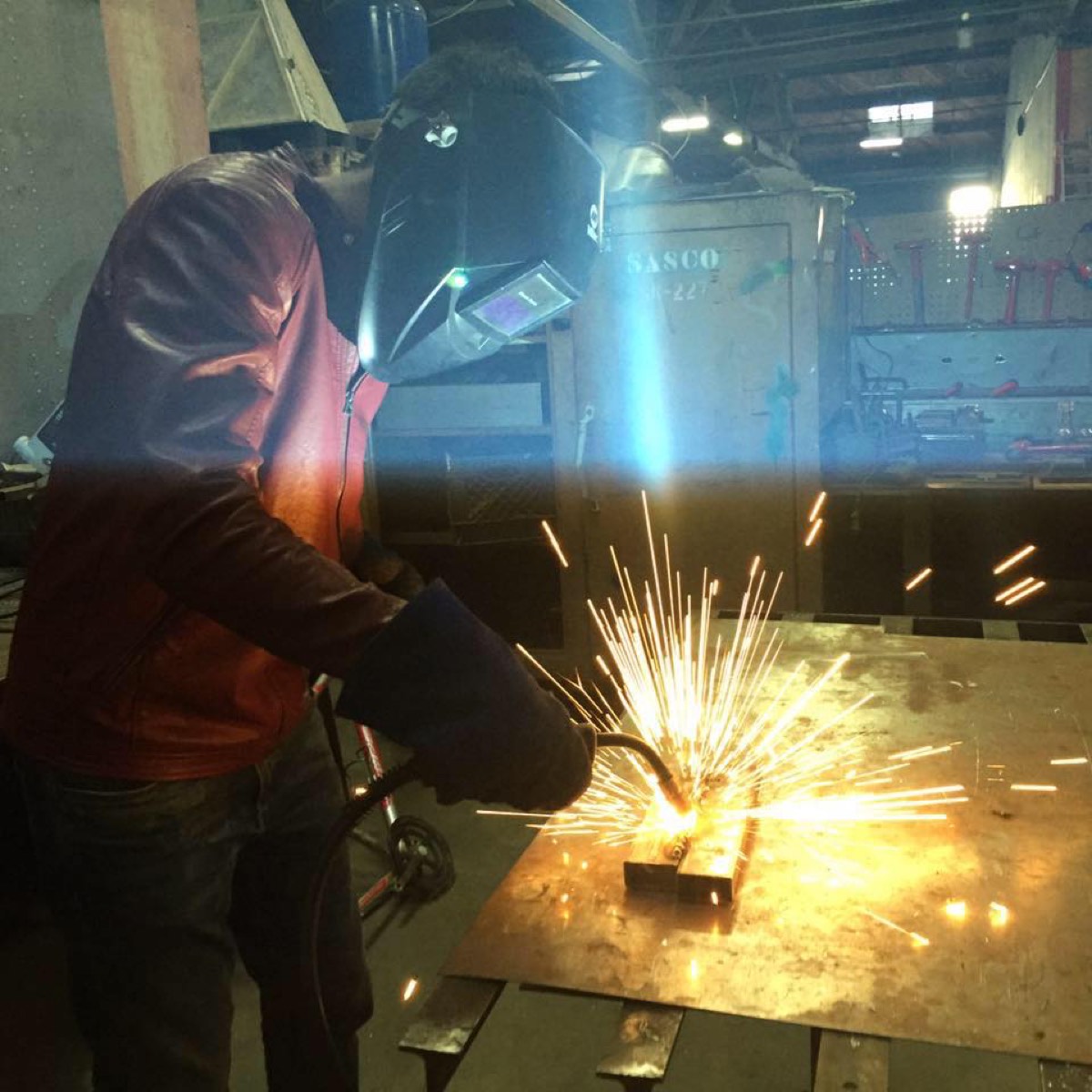 Welding, sparks coming off the bench